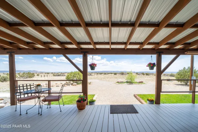 a view of a balcony with wooden floor