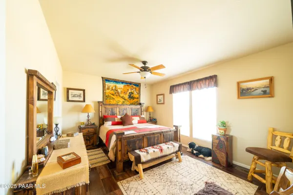a kitchen with refrigerator a stove a sink dishwasher and wooden cabinets