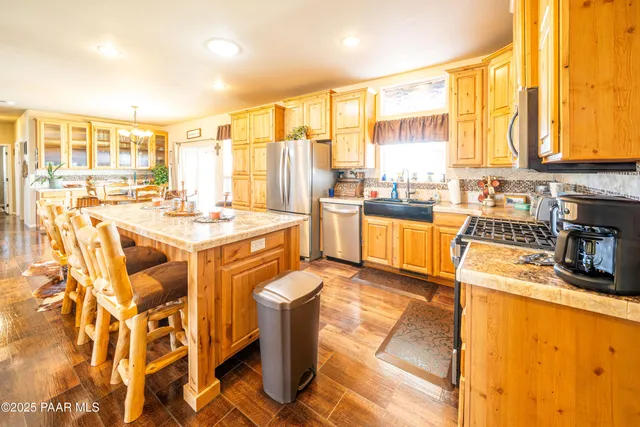 a dining table tennis chairs and kitchen view