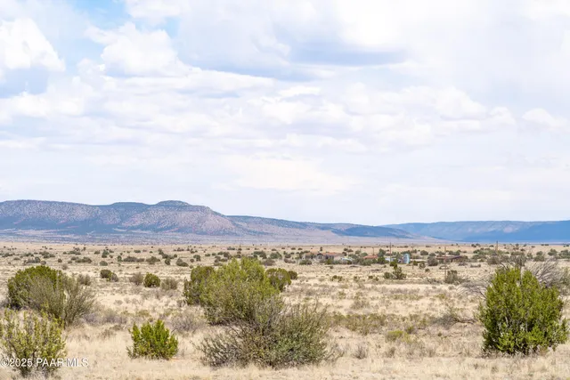 a view of ocean with a mountain