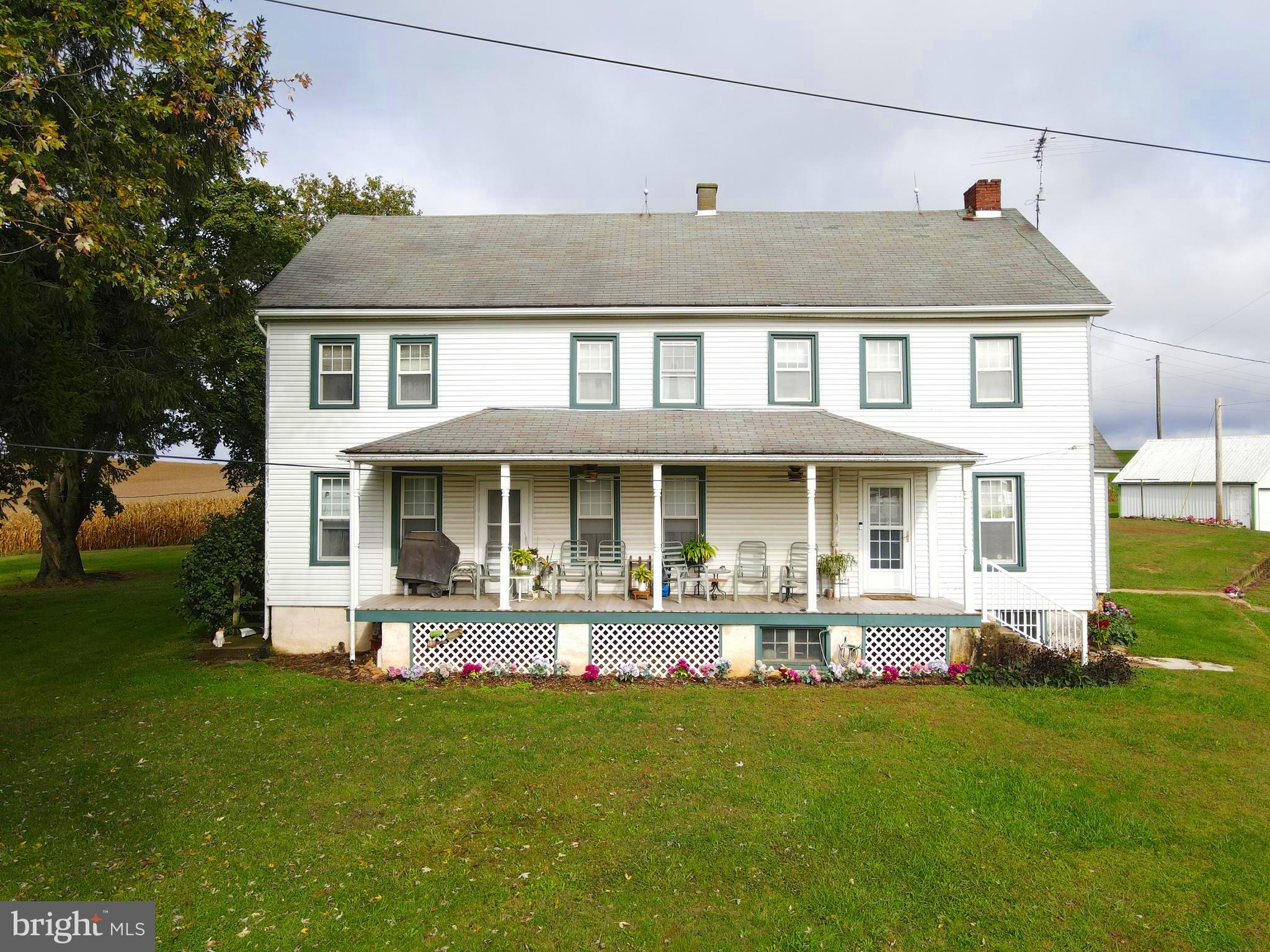 888 Hilldale Road Holtwood, PA 17532 - Photo 29 of 47 a front view of a house with a yard table and chairs