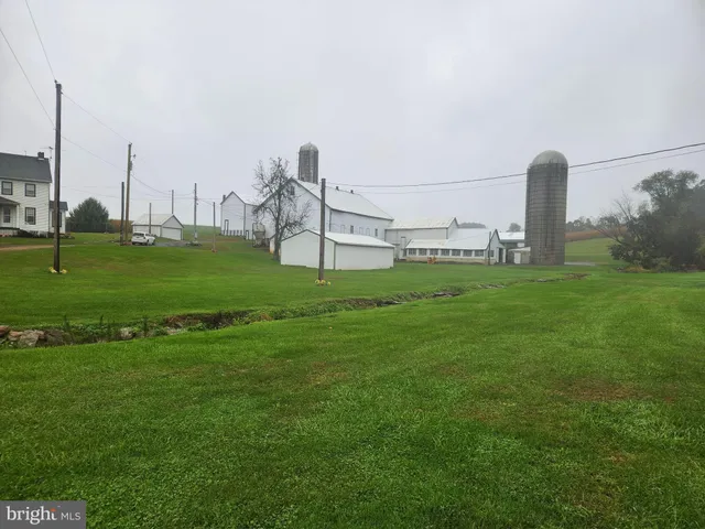 a view of a garden with a large bridge