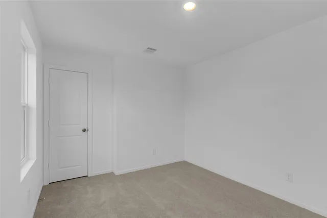 a house view with a backyard space