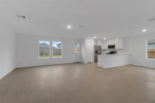 a view of a kitchen with a sink cabinets and a window