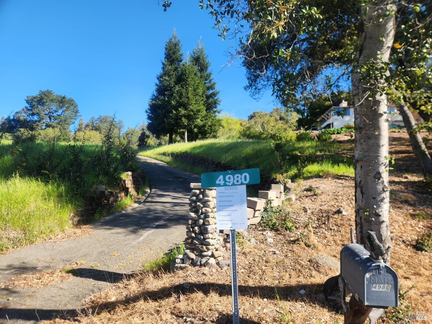 4980 Carriage Lane Santa Rosa, CA 95403 - Photo 8 of 12 a view of a pathway of a building with a yard