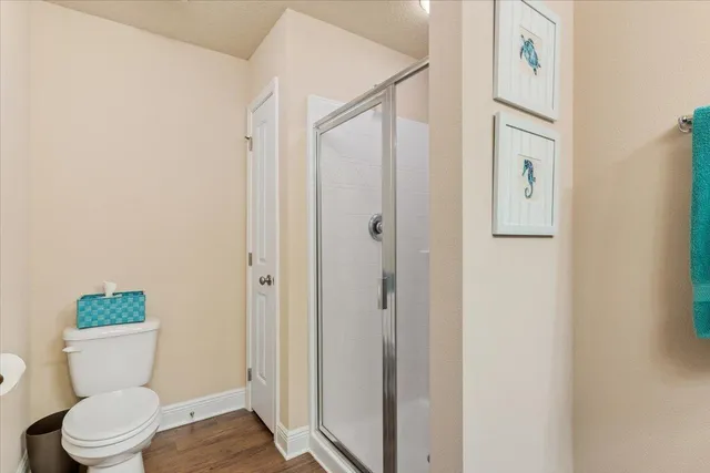 a white toilet sitting next to a bathroom sink