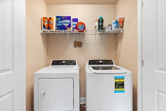 a utility room with dryer and washer