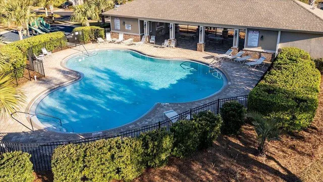 a view of a swimming pool with a patio