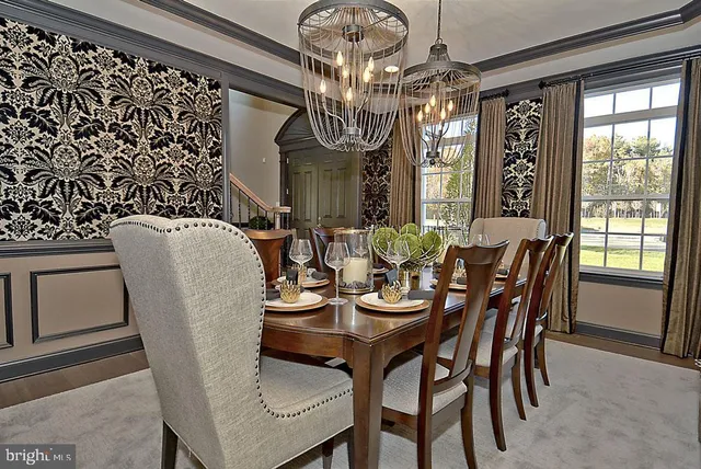 a kitchen with kitchen island a sink counter top space appliances and cabinets