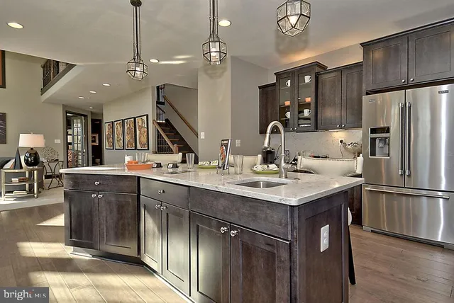 a view of a dining room with furniture and chandelier