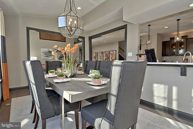 a white toilet sitting next to a white sink