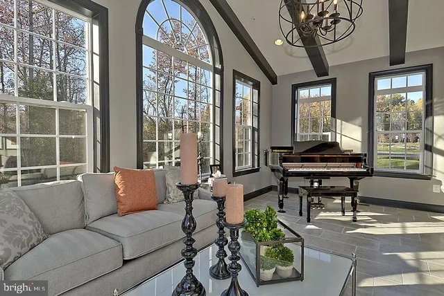 a bed room with a bed mirror furniture and a window