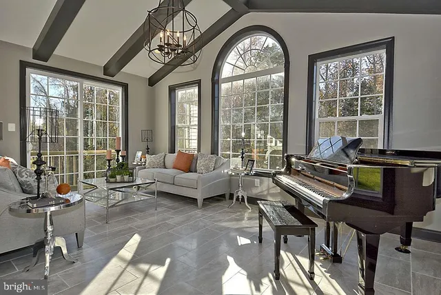 a living room with a fireplace and a flat screen tv