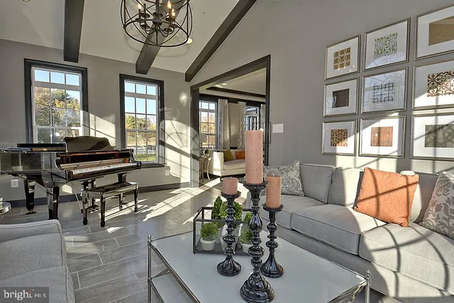 a living room with furniture and a window