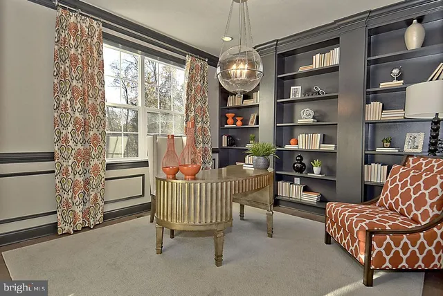 a view of walk in closet with clothes