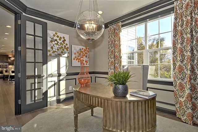 a bedroom that has a bed and a table in it