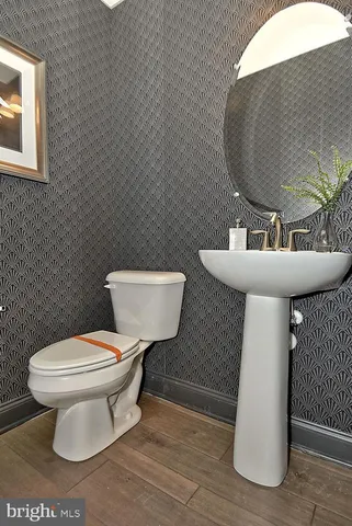 a bedroom with a bed and a dresser in it