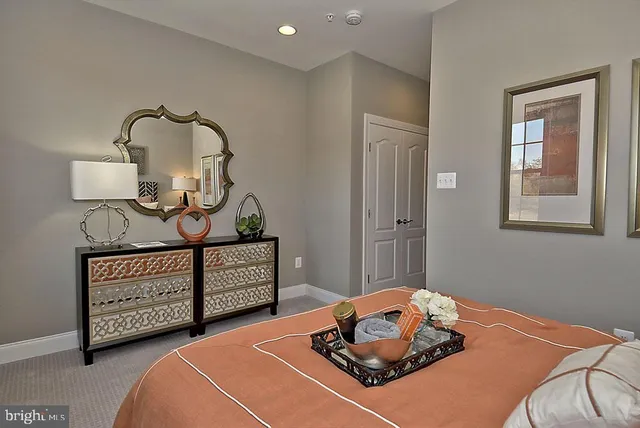 a view of front door with wooden floor and a window