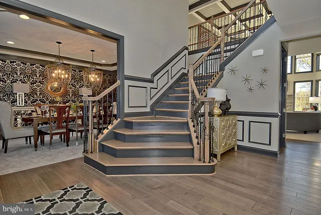 a view of a dining room with furniture and chandelier