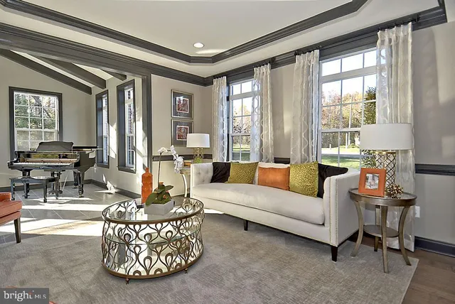 a view of a dining room with furniture and chandelier