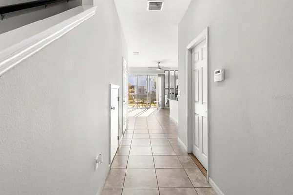 a view of a hallway with a outdoor space