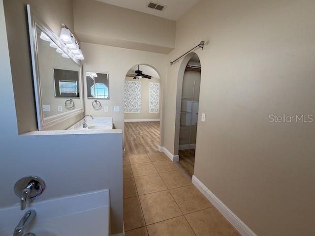 2551 Hunley Loop Kissimmee, FL 34743 - Photo 15 of 24 a bathroom with a bathtub and a sink