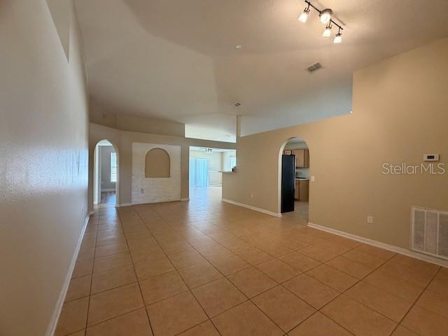 2551 Hunley Loop Kissimmee, FL 34743 - Photo 6 of 24 a view of empty room with wooden floor