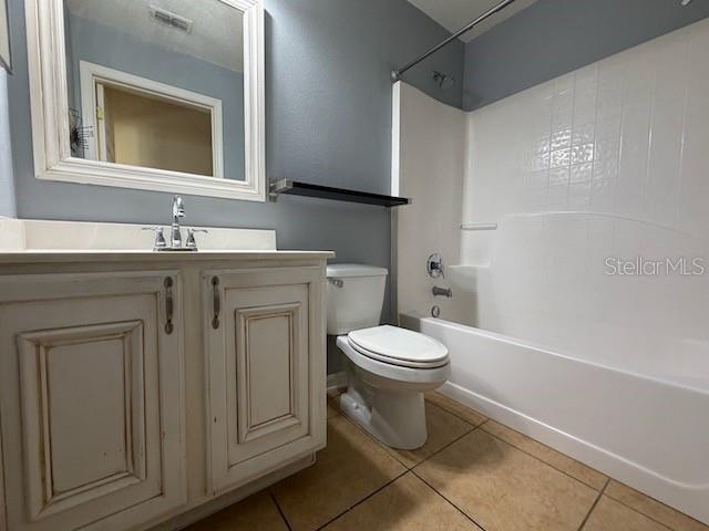 2551 Hunley Loop Kissimmee, FL 34743 - Photo 9 of 24 a bathroom with a toilet sink and mirror
