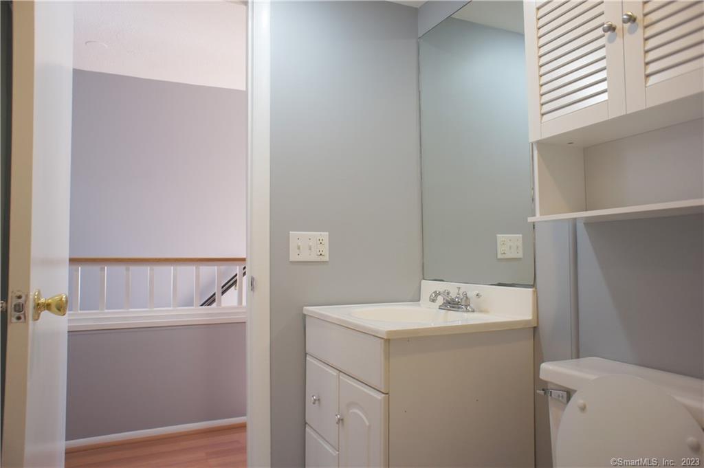 2 Juneberry Lane, Unit 2 Ridgefield, CT 06877 - Photo 16 of 29 a bathroom with a sink and mirror