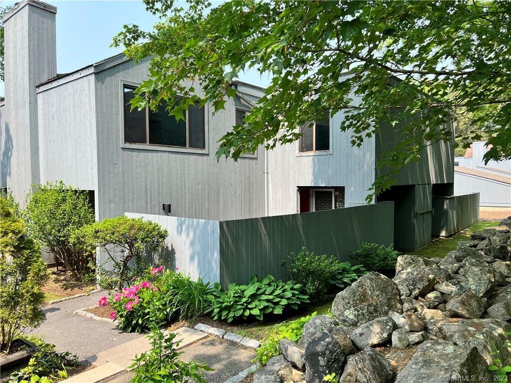 2 Juneberry Lane, Unit 2 Ridgefield, CT 06877 - Photo 2 of 29 a view of a house with a big yard plants and large trees