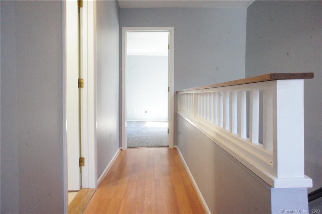 2 Juneberry Lane, Unit 2 Ridgefield, CT 06877 - Photo 21 of 29 a view of a hallway with wooden floor and entryway