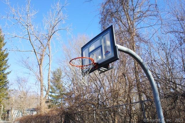 2 Juneberry Lane, Unit 2 Ridgefield, CT 06877 - Photo 23 of 29 a view of a backyard with a large tree