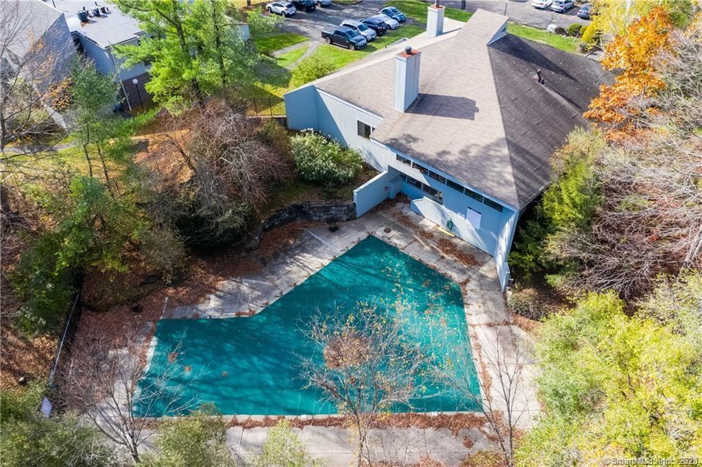 2 Juneberry Lane, Unit 2 Ridgefield, CT 06877 - Photo 26 of 29 a view of a house with a yard and plants