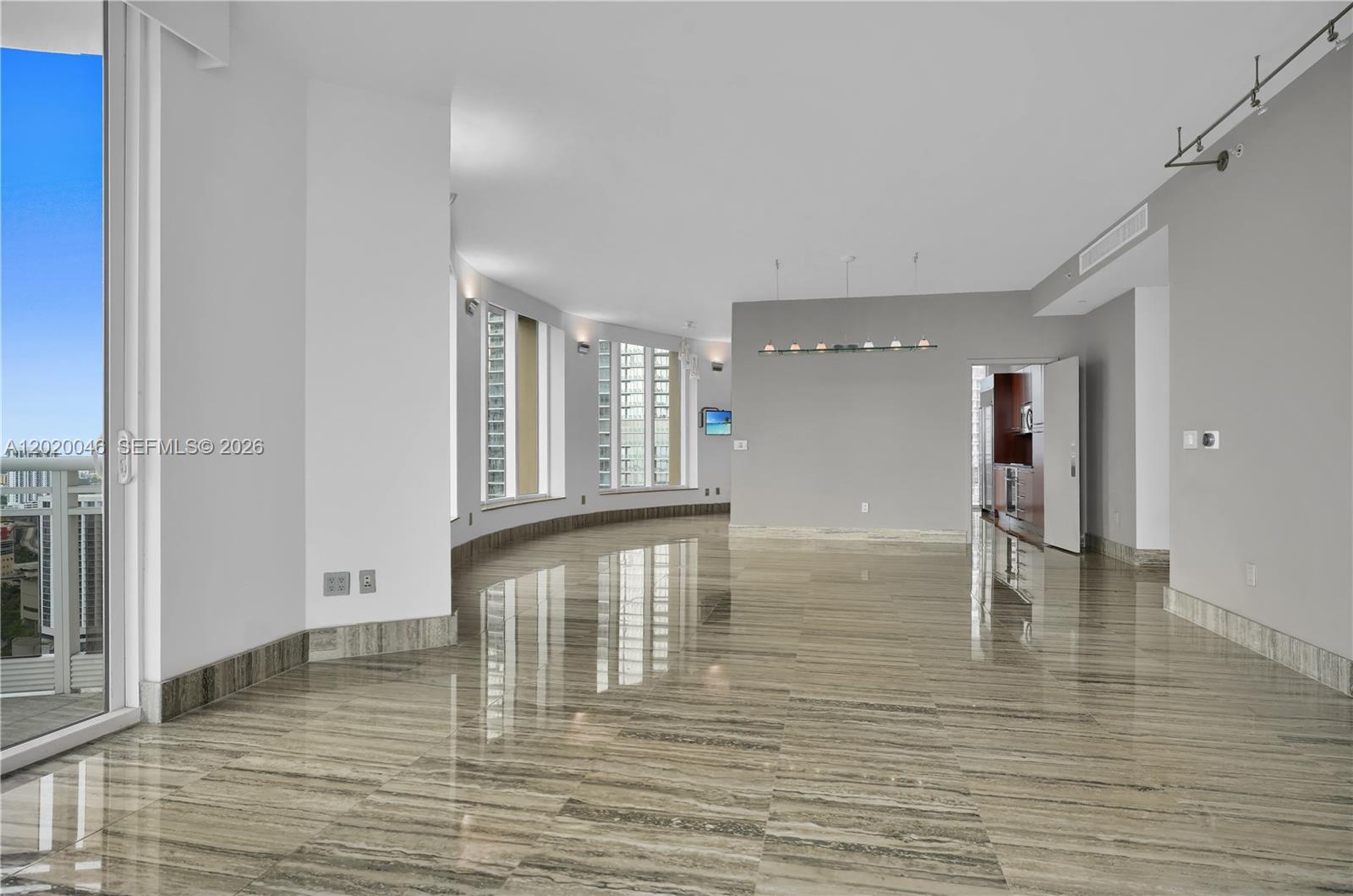 901 Brickell Key Boulevard, Unit 3204 Miami, FL 33131 - Photo 12 of 55 a view of empty room with wooden floor
