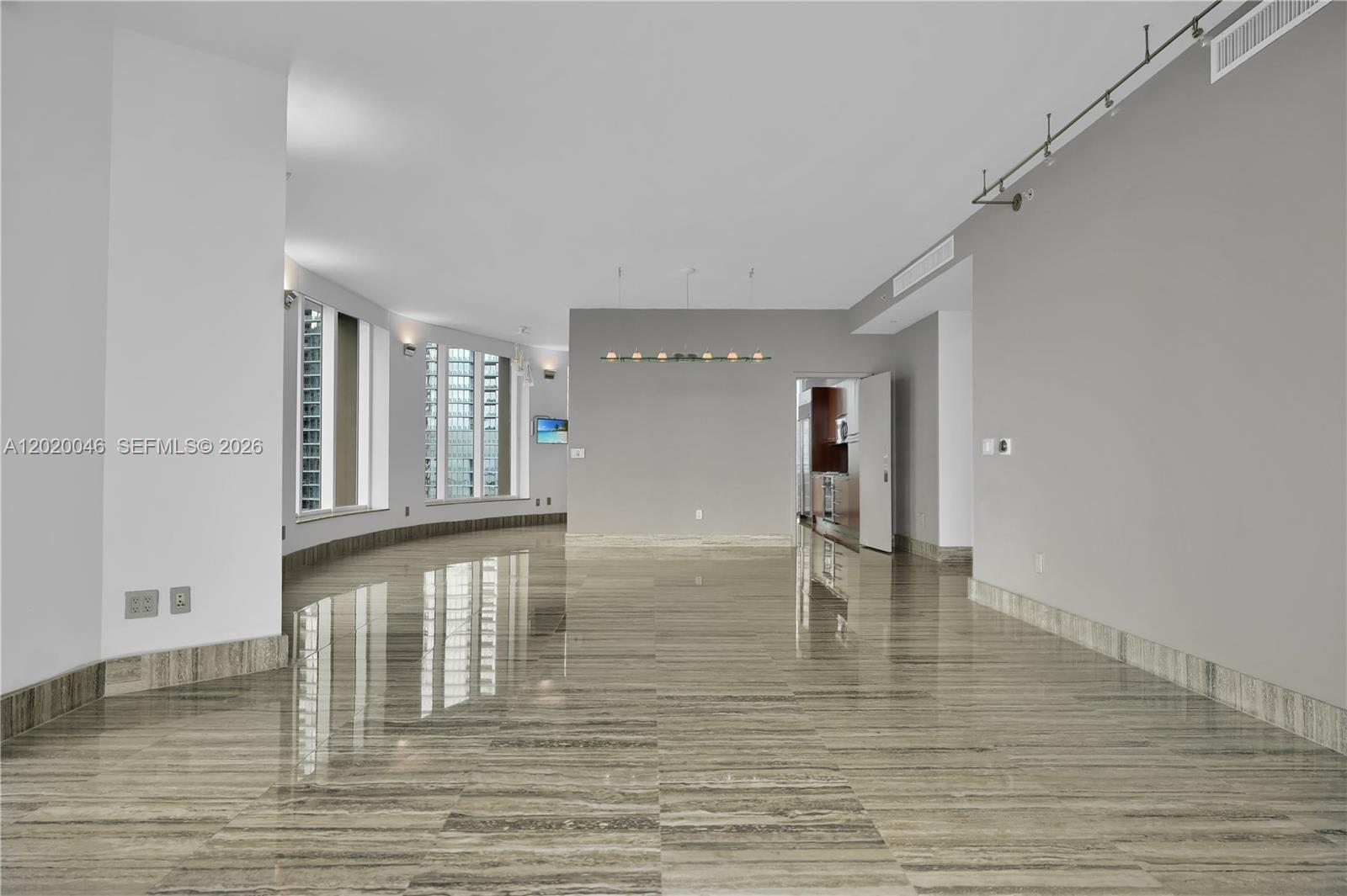 901 Brickell Key Boulevard, Unit 3204 Miami, FL 33131 - Photo 13 of 55 a view of empty room with wooden floor