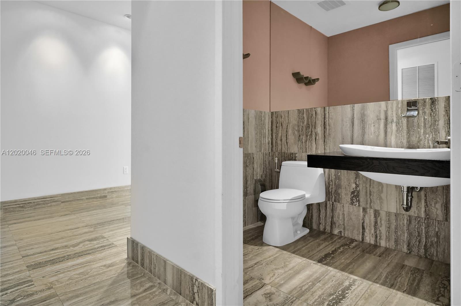901 Brickell Key Boulevard, Unit 3204 Miami, FL 33131 - Photo 27 of 55 a bathroom with a toilet and a shower