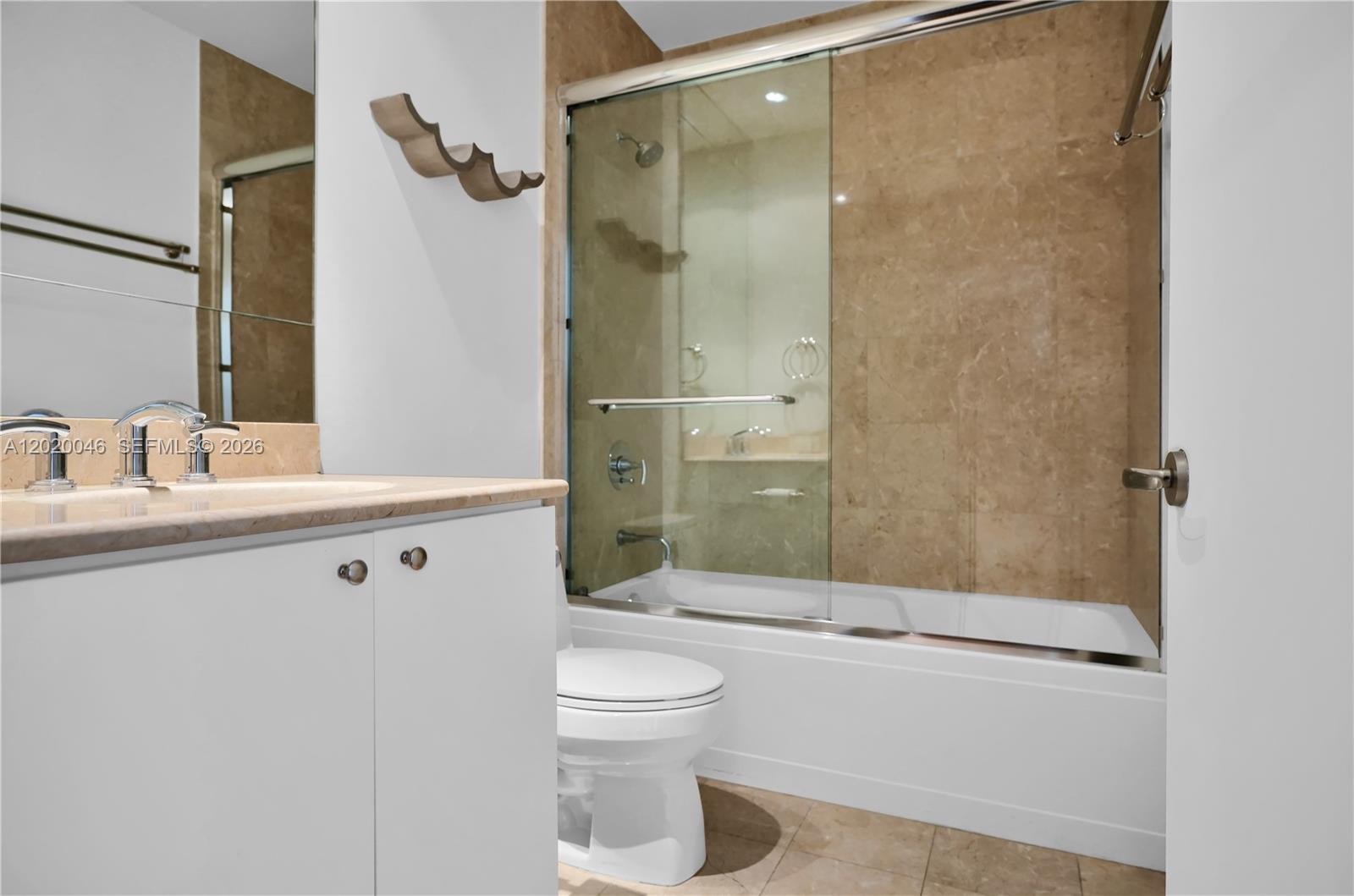 901 Brickell Key Boulevard, Unit 3204 Miami, FL 33131 - Photo 29 of 55 a bathroom with a sink a toilet and shower