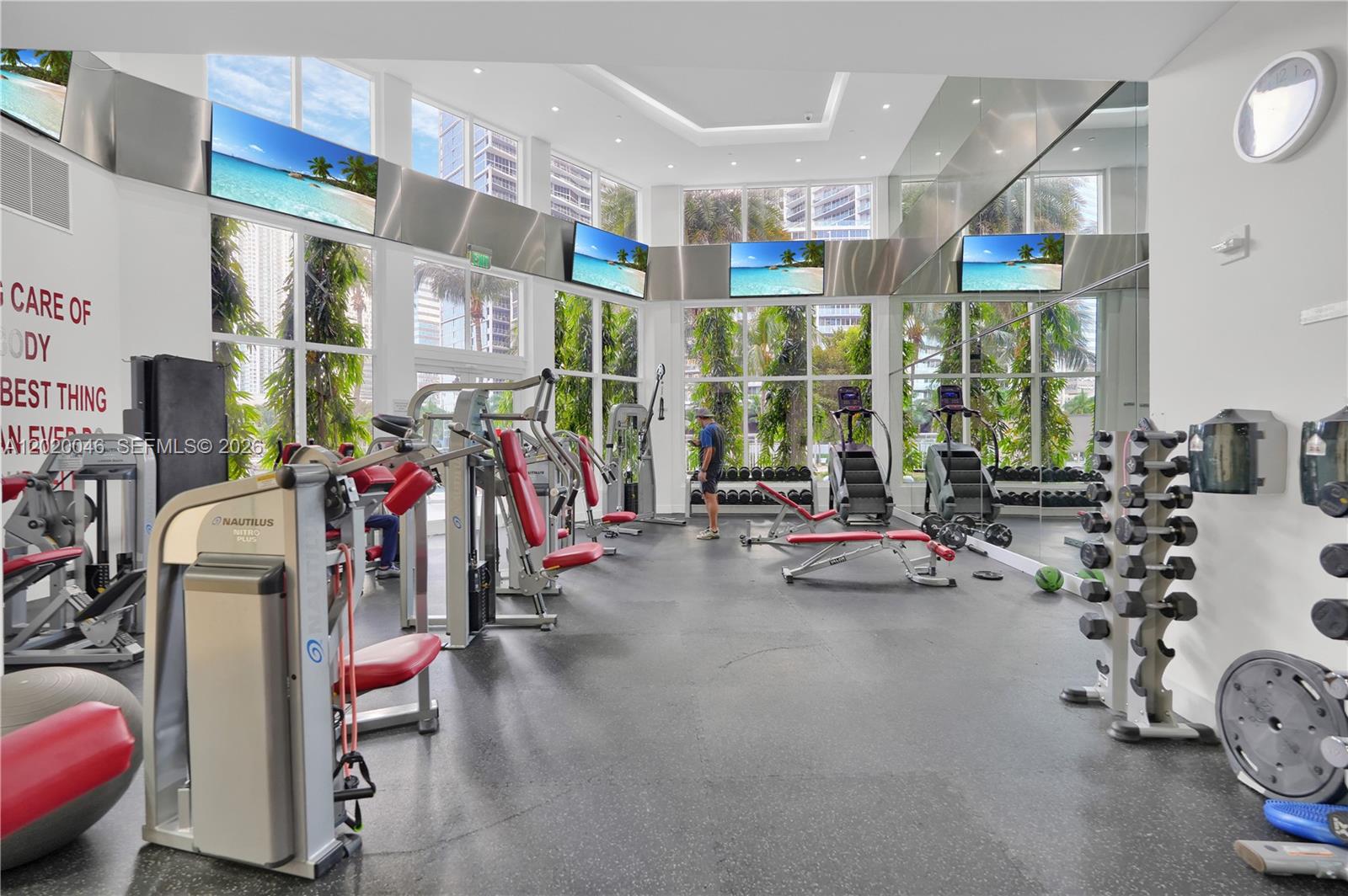 901 Brickell Key Boulevard, Unit 3204 Miami, FL 33131 - Photo 43 of 55 a view of a room with gym equipment