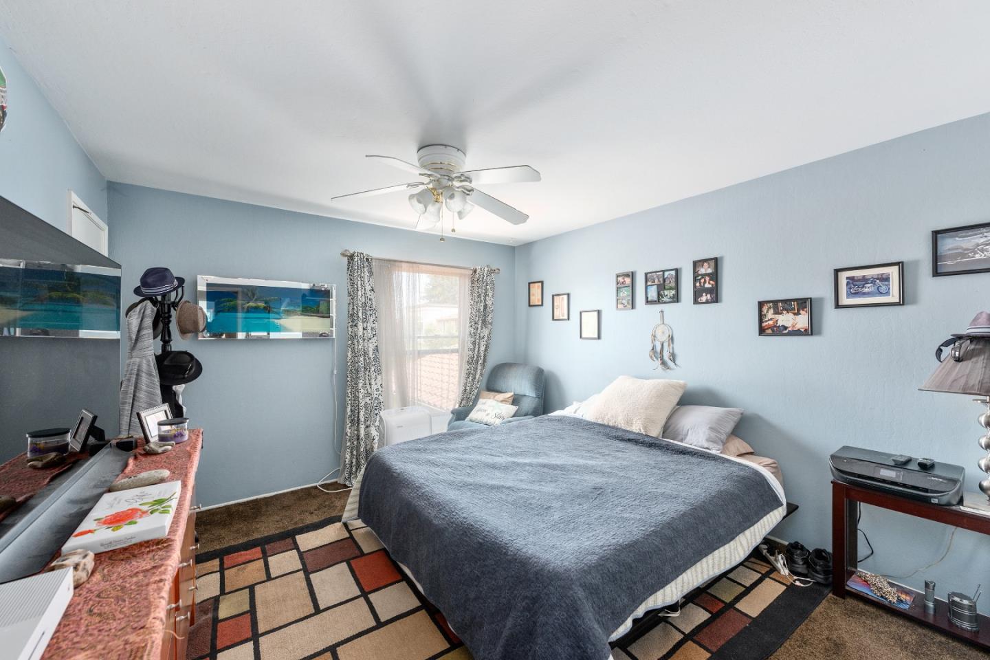 110 Salice Way Campbell, CA 95008 - Photo 11 of 14 a bedroom with a bed and a chandelier