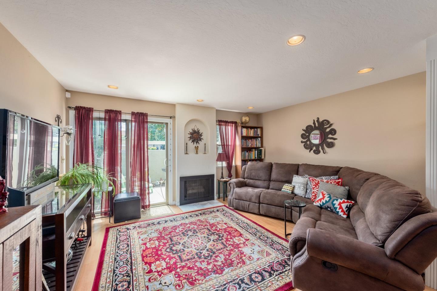 110 Salice Way Campbell, CA 95008 - Photo 2 of 14 a living room with furniture fireplace and rug