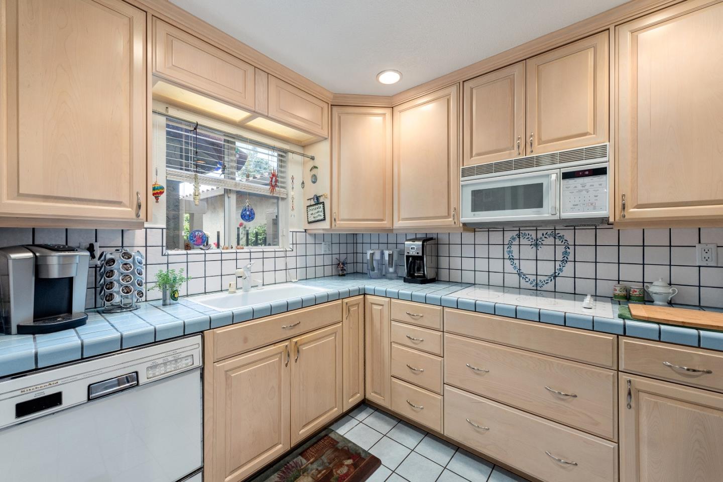 110 Salice Way Campbell, CA 95008 - Photo 6 of 14 a kitchen with sink cabinets and window