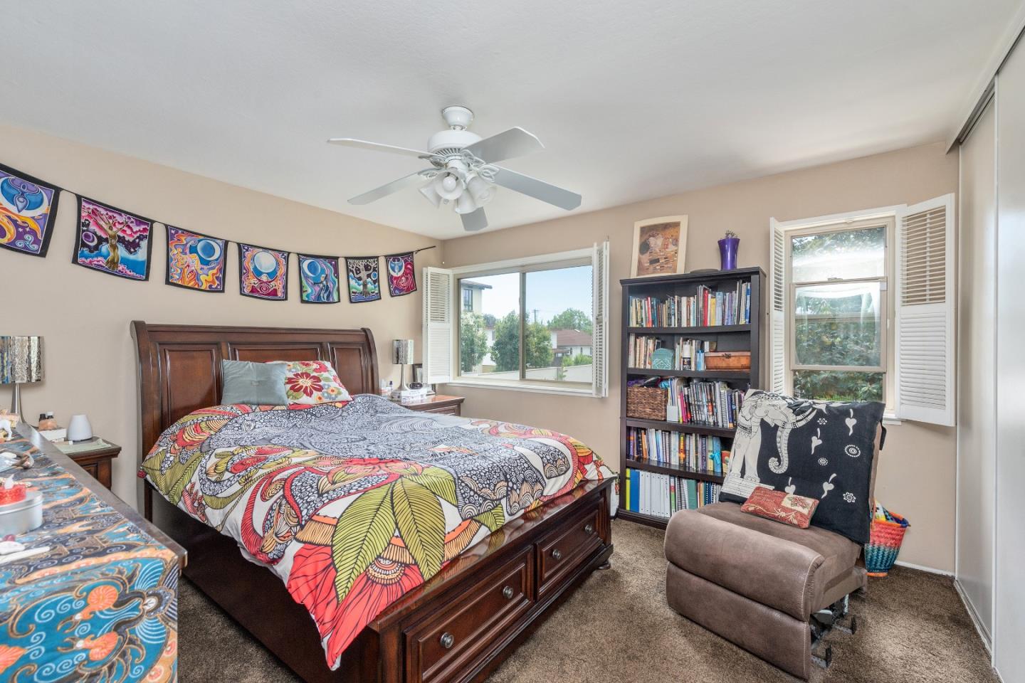 110 Salice Way Campbell, CA 95008 - Photo 9 of 14 a bedroom with a bed a couch and a book shelf