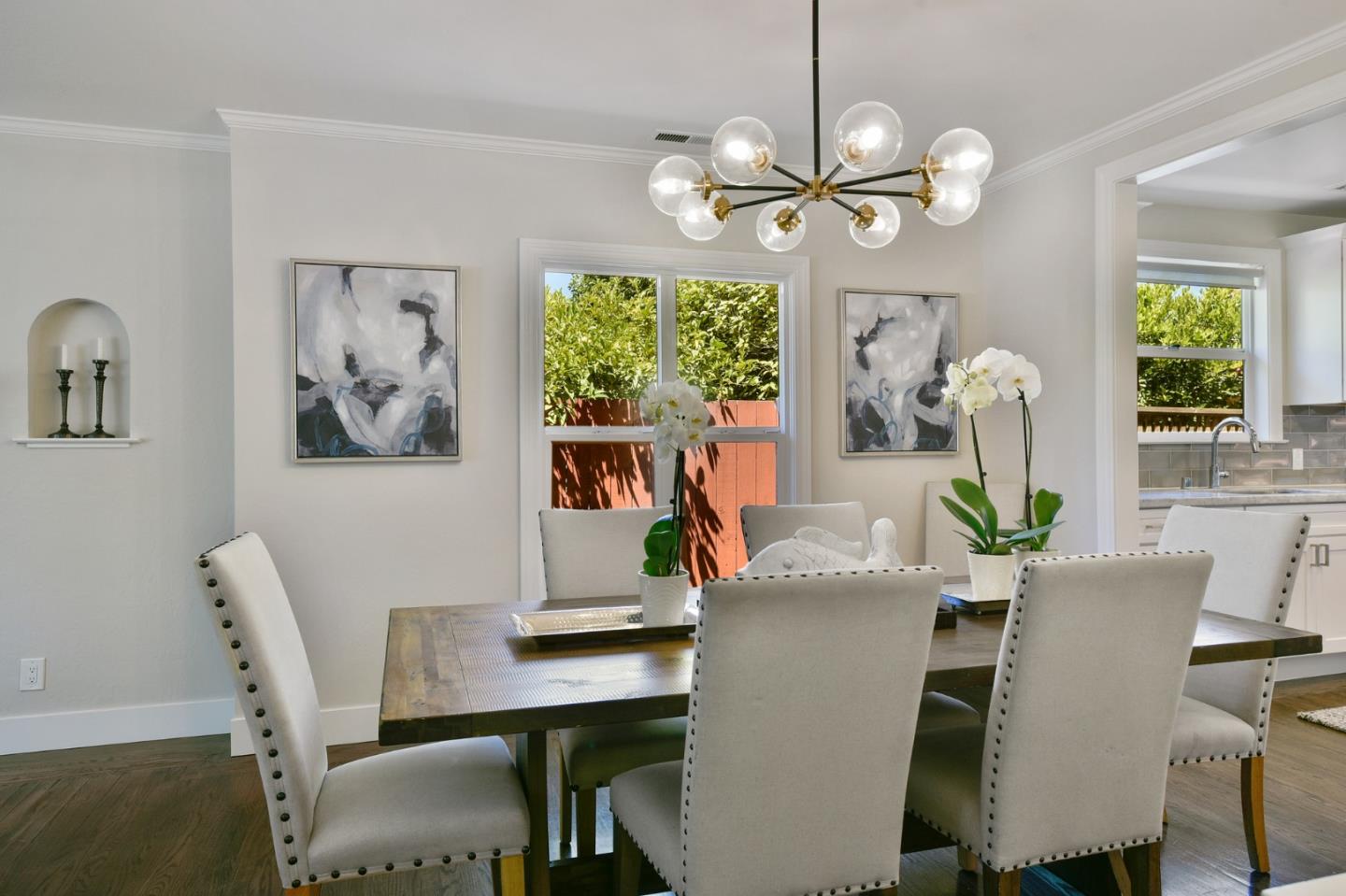 232 Bancroft Road Burlingame, CA 94010 - Photo 22 of 69 a dining room with furniture a large window and a chandelier