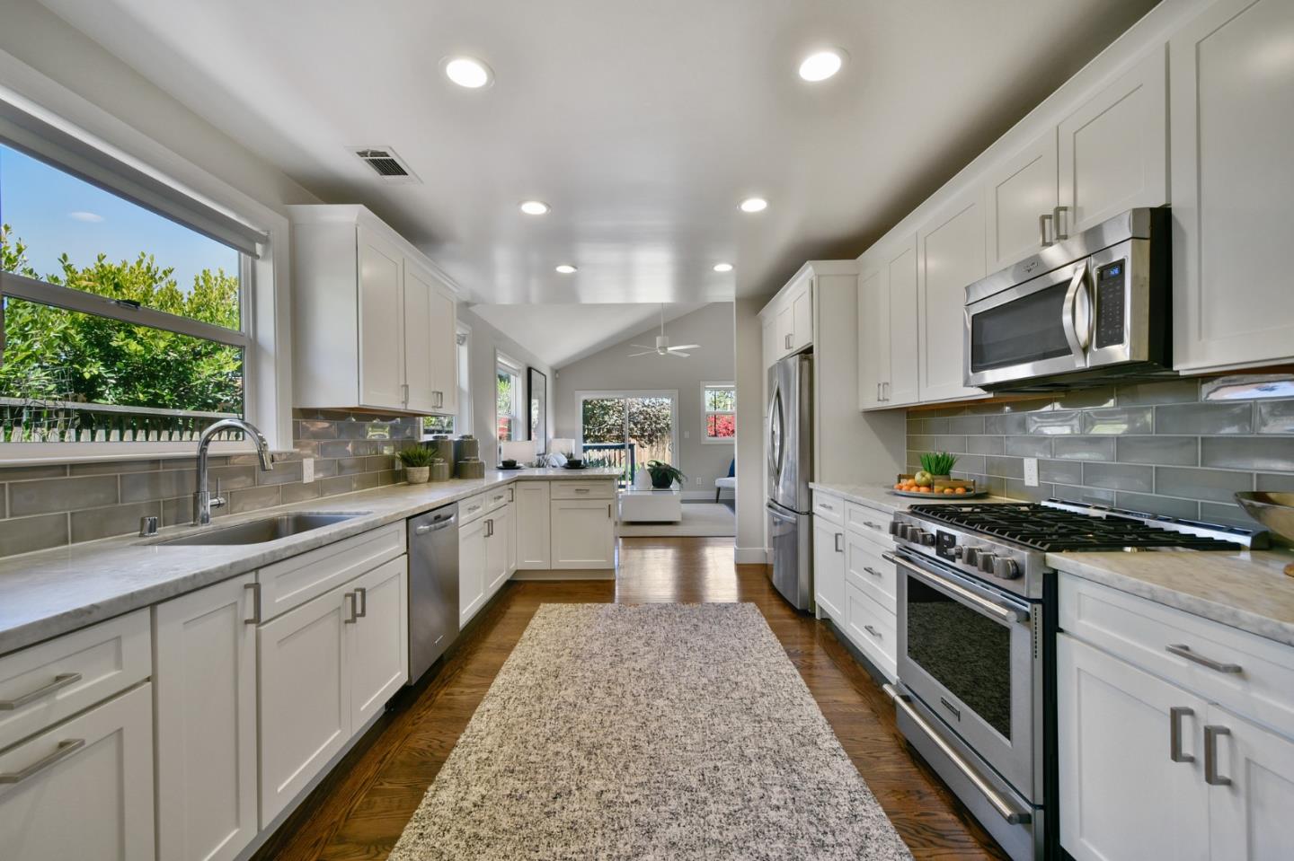 232 Bancroft Road Burlingame, CA 94010 - Photo 25 of 69 a large kitchen with stainless steel appliances granite countertop a stove a sink and a microwave
