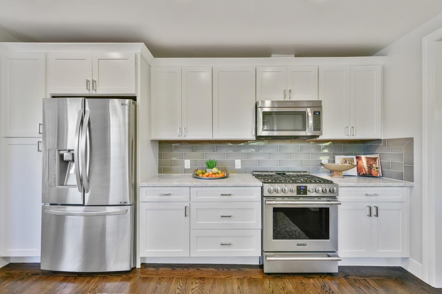 232 Bancroft Road Burlingame, CA 94010 - Photo 27 of 69 a kitchen with stainless steel appliances a refrigerator stove and white cabinets