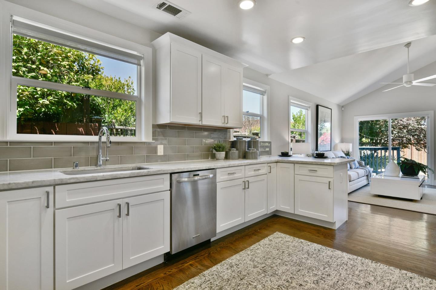232 Bancroft Road Burlingame, CA 94010 - Photo 30 of 69 a kitchen with sink cabinets and wooden floor