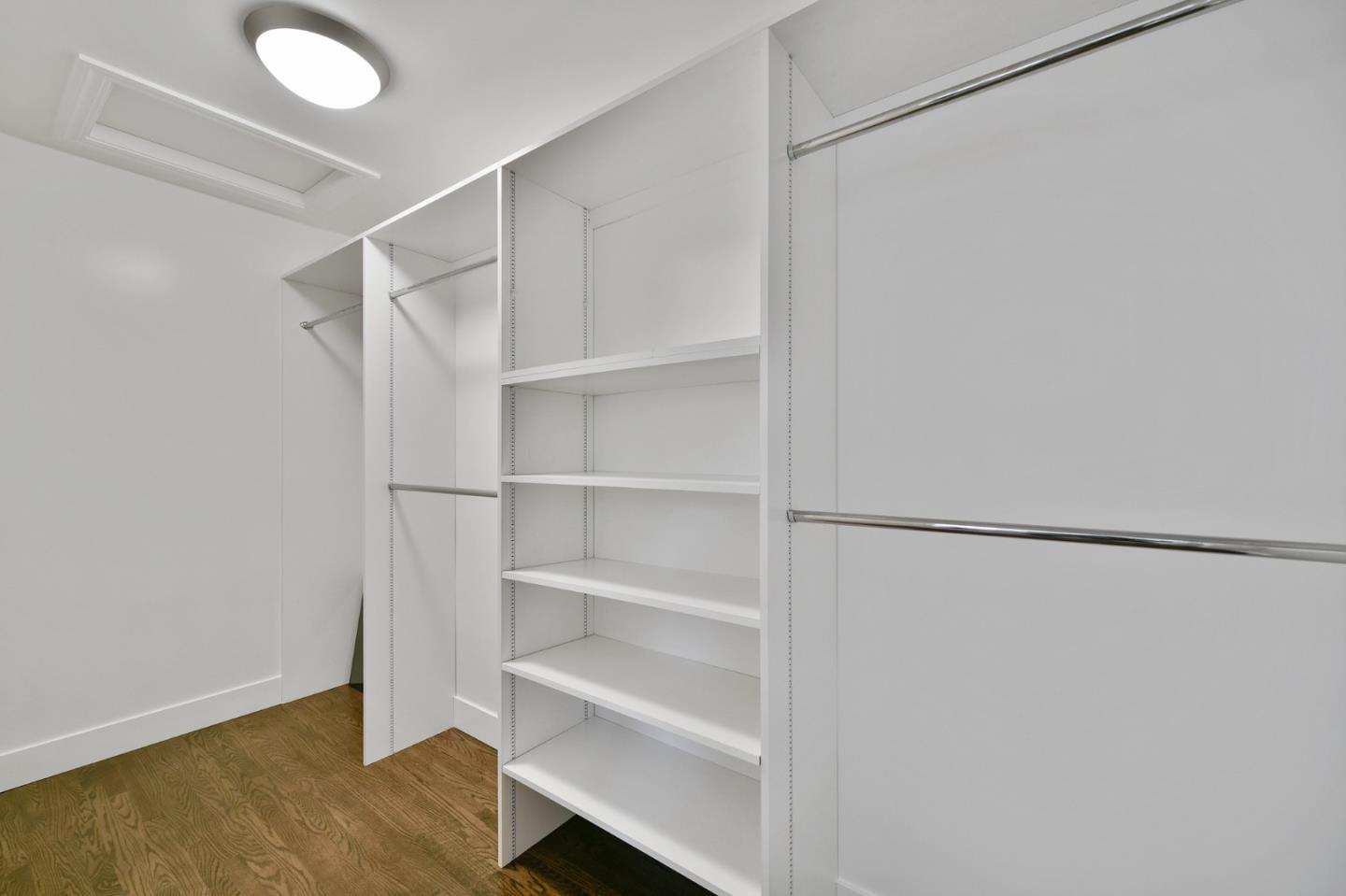 232 Bancroft Road Burlingame, CA 94010 - Photo 40 of 69 a view of walk in closet with empty racks