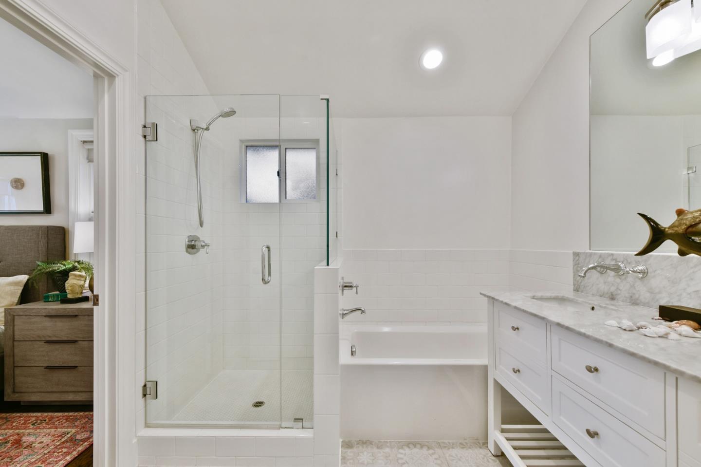 232 Bancroft Road Burlingame, CA 94010 - Photo 42 of 69 a bathroom with a tub shower vanity and a sink