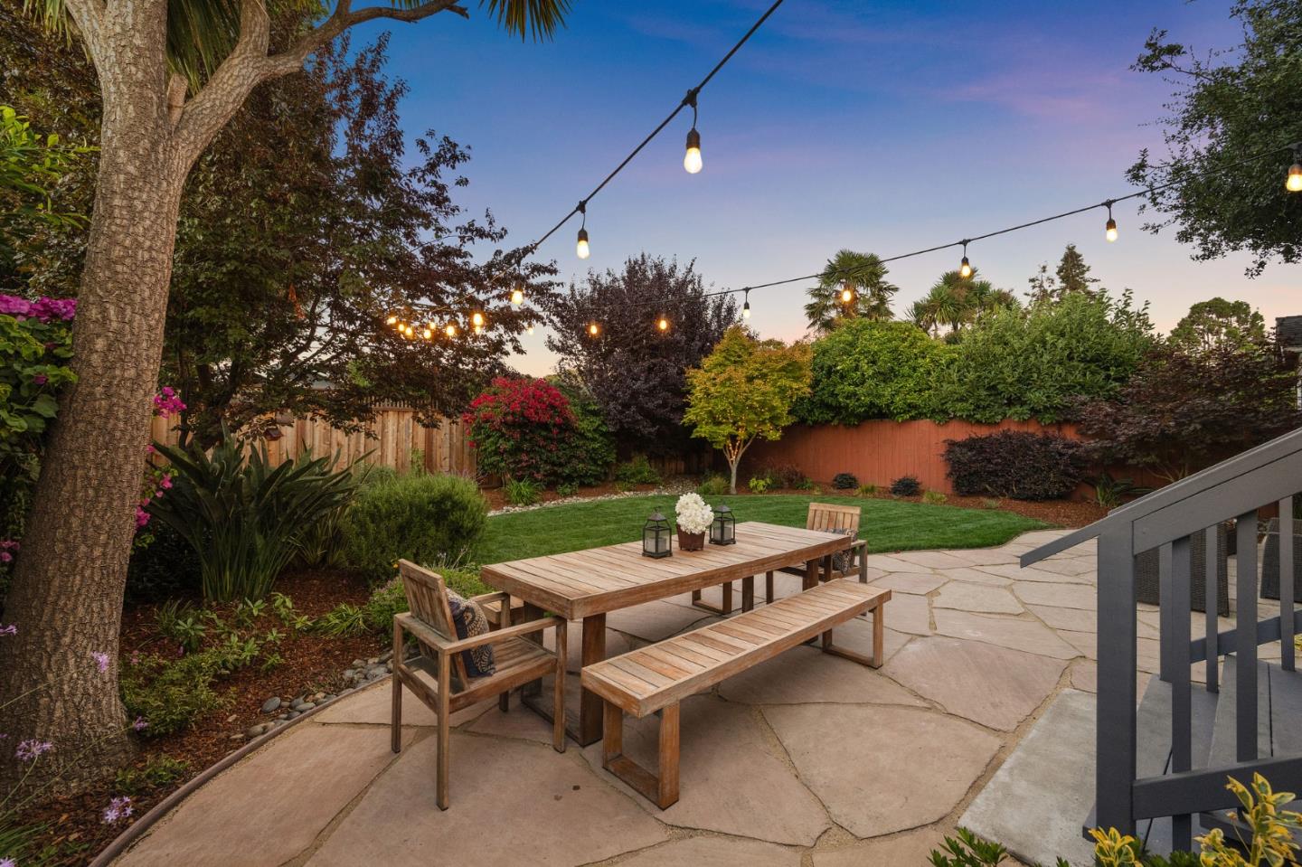 232 Bancroft Road Burlingame, CA 94010 - Photo 63 of 69 a view of a patio with a table and chairs under an umbrella