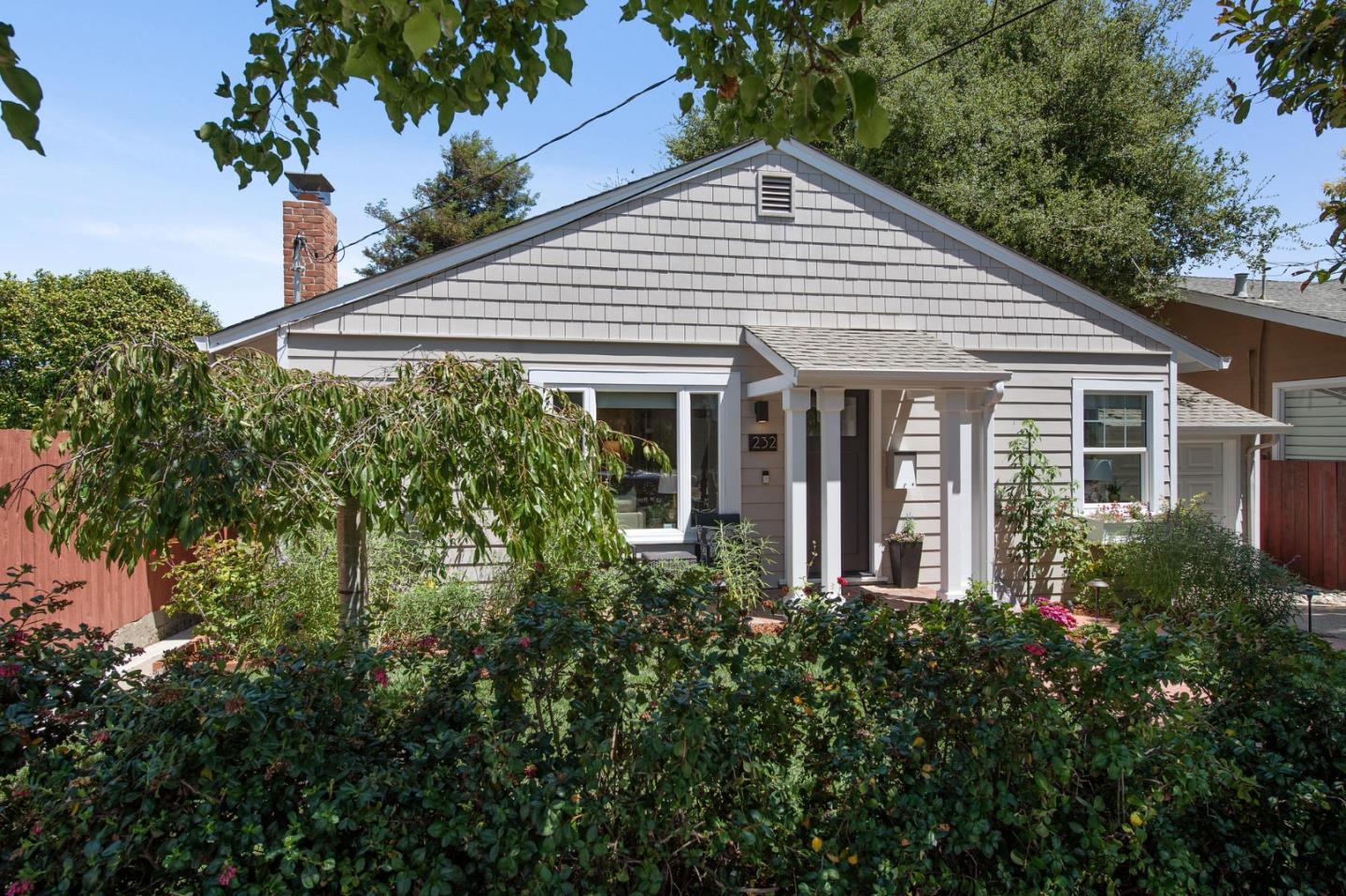 232 Bancroft Road Burlingame, CA 94010 - Photo 10 of 69 a front view of a house with a yard